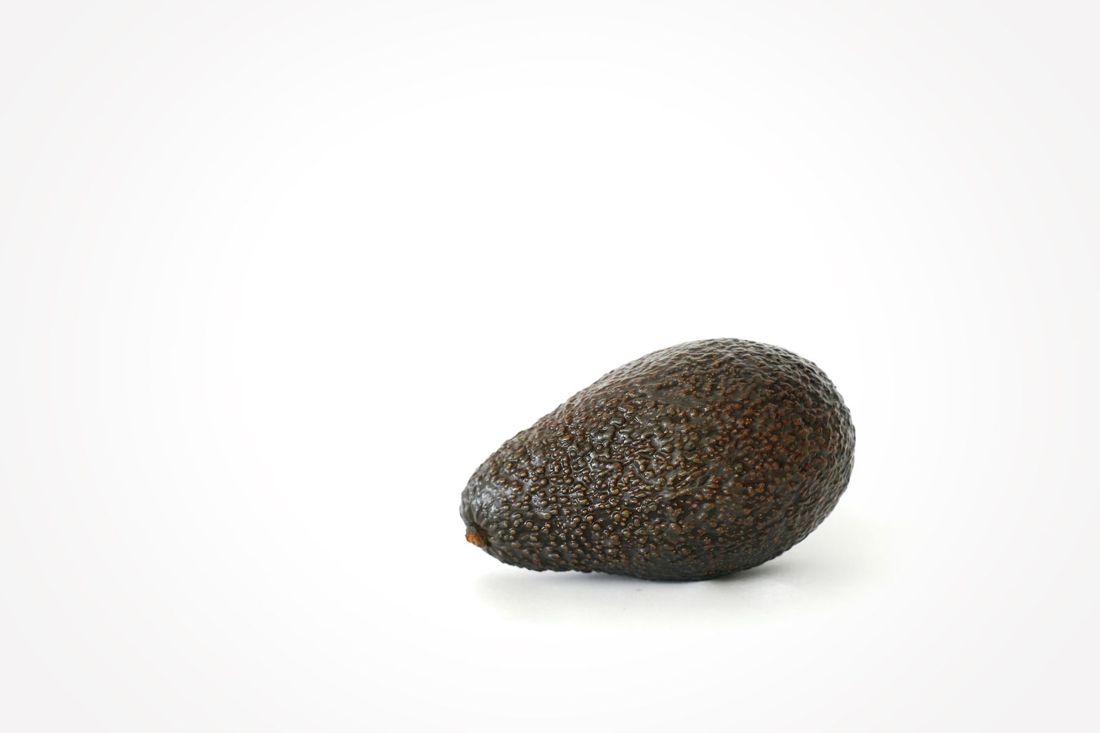Ripe avocado on a white background