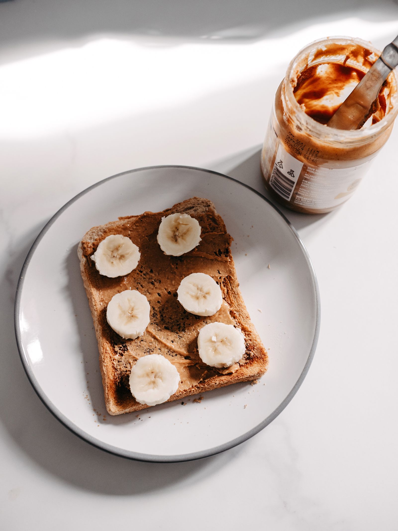 Peanut butter toast with banana slices
