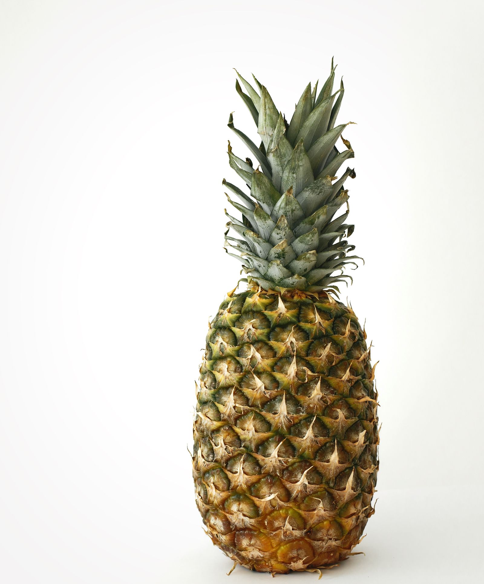 Ripe pineapple on a white background