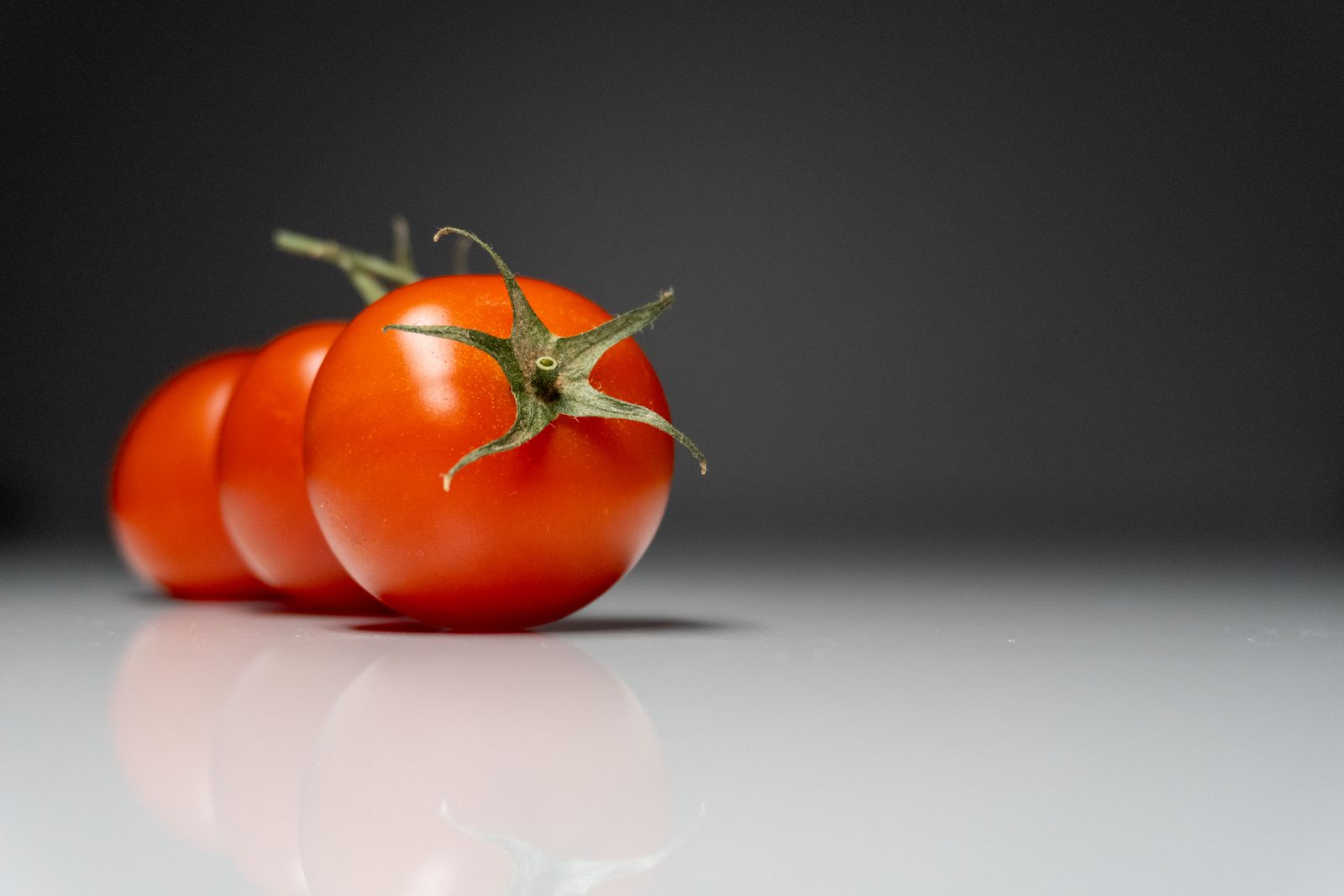Fresh tomatoes on a white background